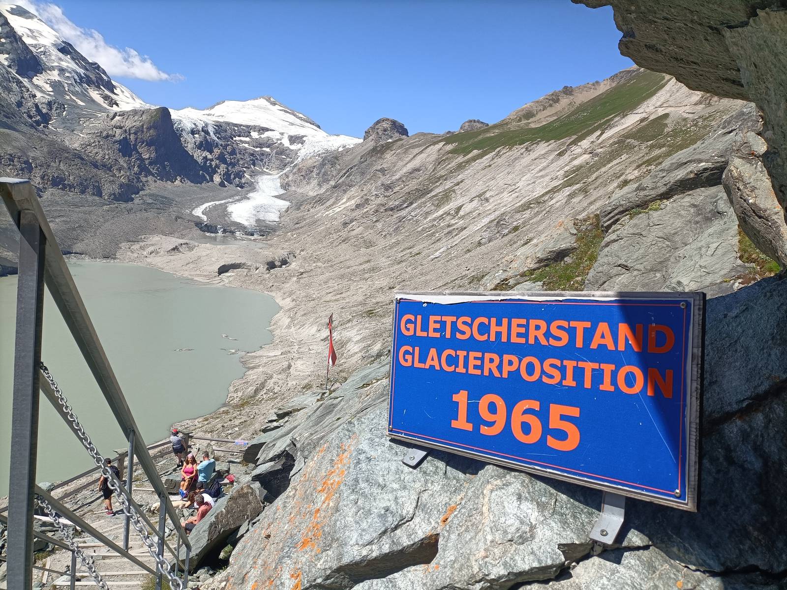 The Pasterze in August 2024, with a sign reading Gletscherstand 1965 marking where the ice stood in 1965